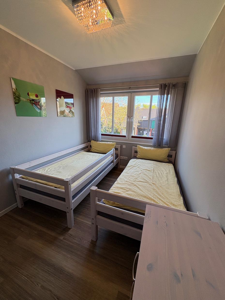 Kinderzimmer mit zwei Einzelbetten im Ferienhaus Nirwana